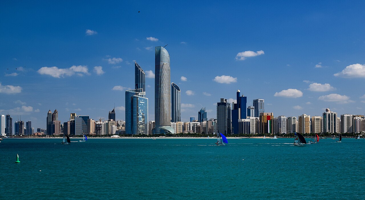 The Abu Dhabi skyline across the water, with towers along the corniche