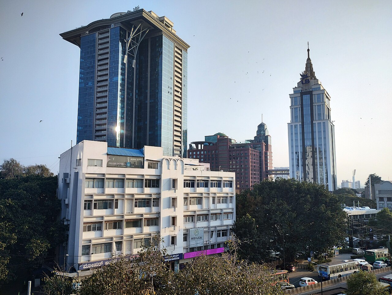 Towers in central Bengaluru, including a glass high-rise and the UB City spire