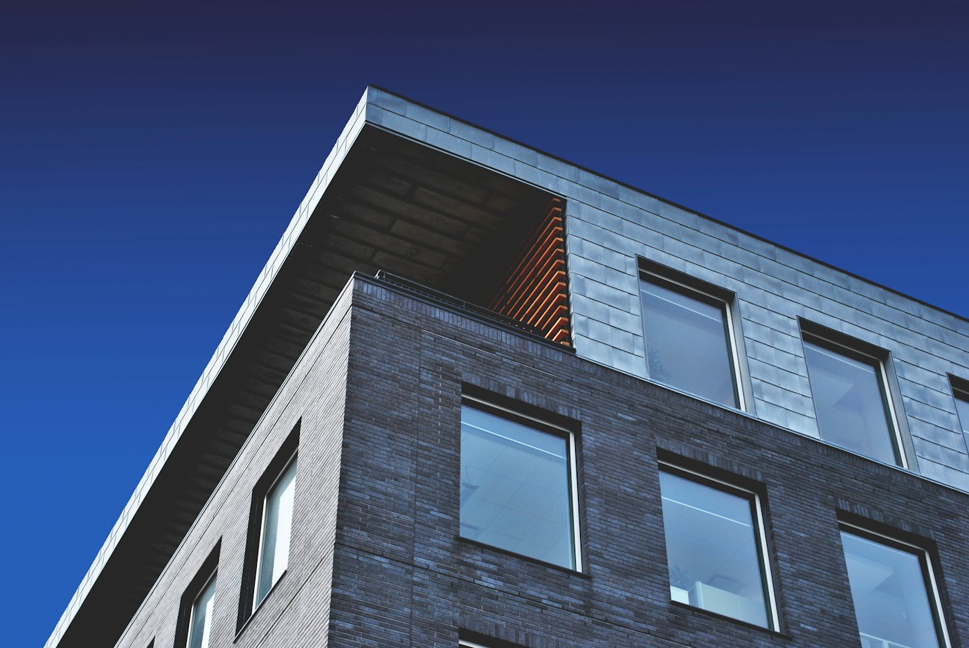 Row of contemporary houses along a quiet residential street