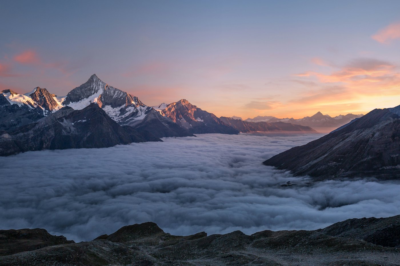 Mountain range under a moving sky