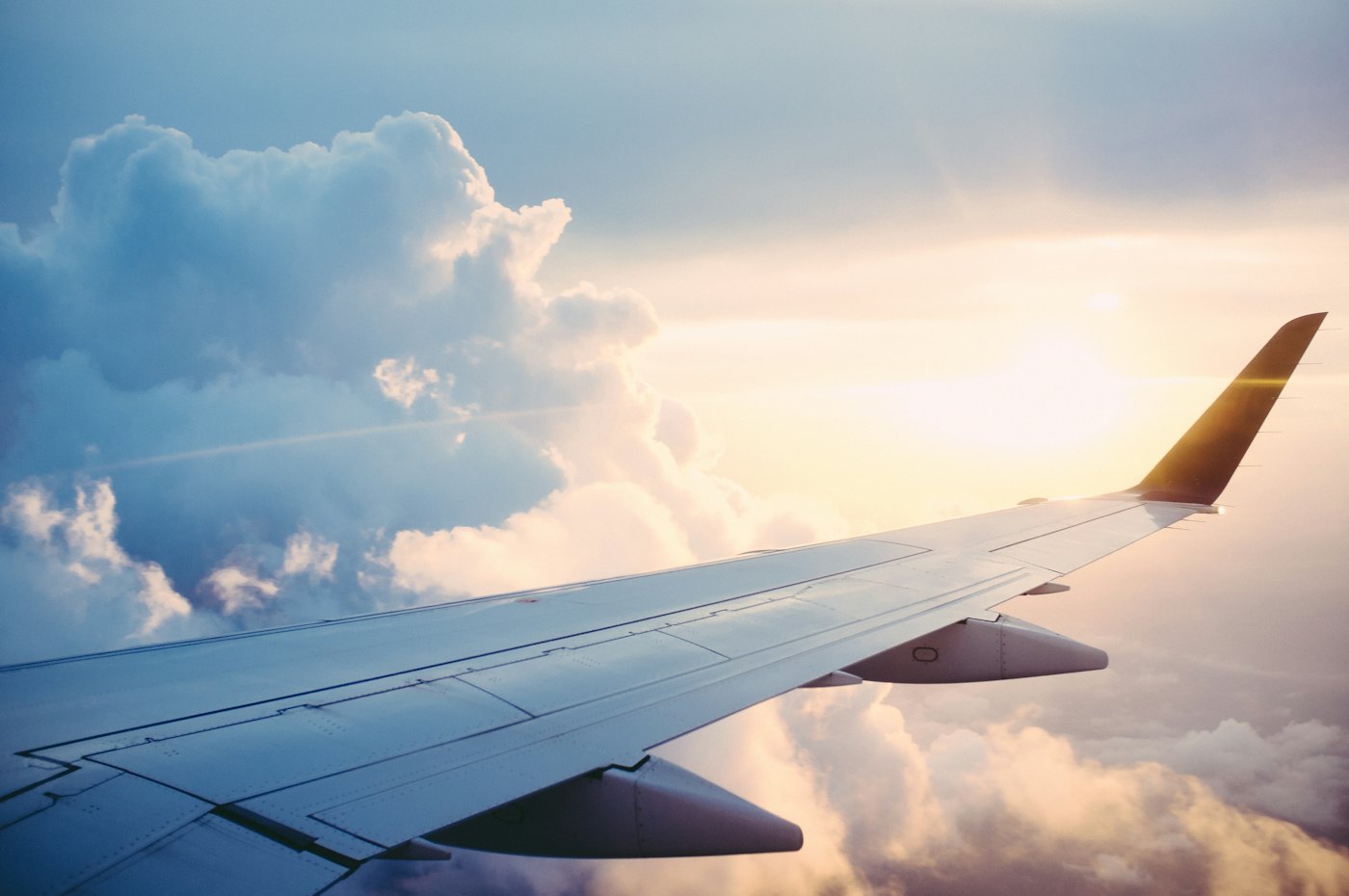 Aircraft wing above a layer of cloud