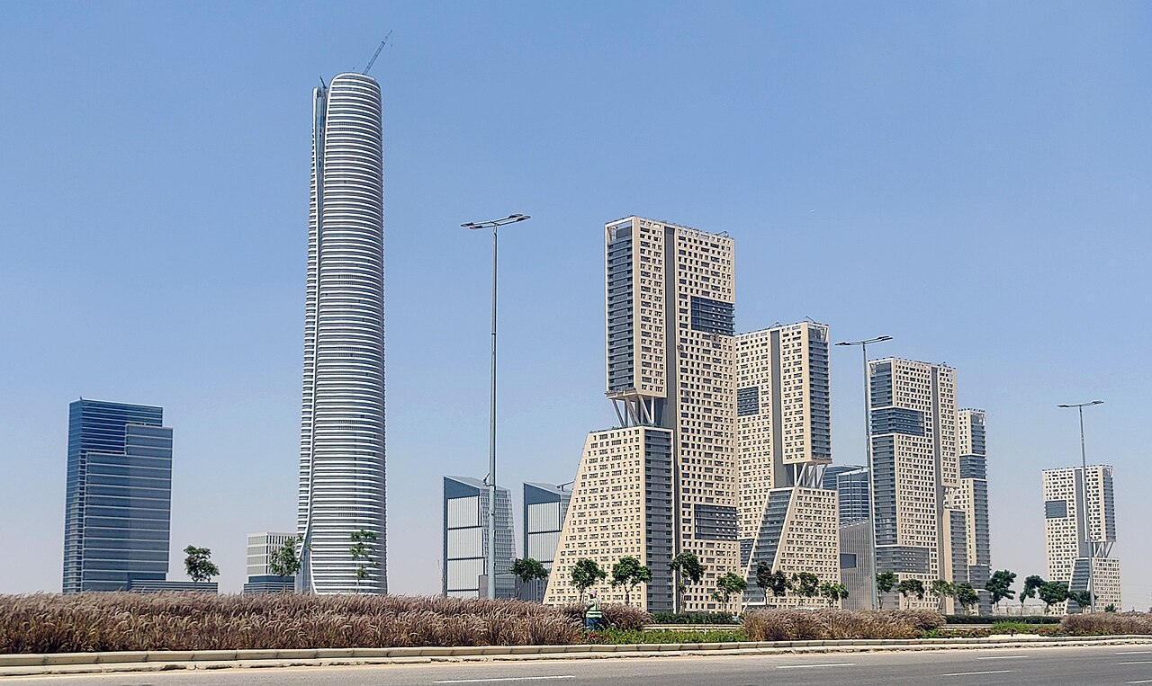 The Iconic Tower in the New Administrative Capital, a glass skyscraper still surrounded by construction cranes