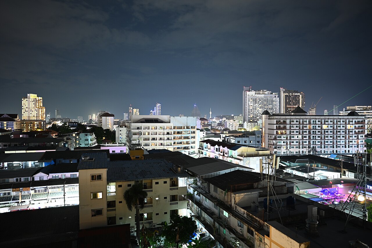 Pattaya’s built shoreline at night, towers along the bay